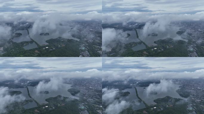 烟雨朦胧云海下的西湖航拍