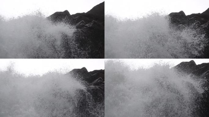 大瀑布从崖壁顶端倾斜而下激起透明白色浪花