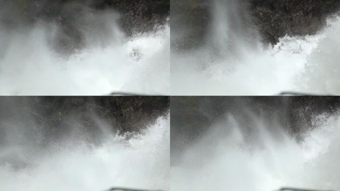 大瀑布从山顶倾斜而下砸入水潭激起白色浪花