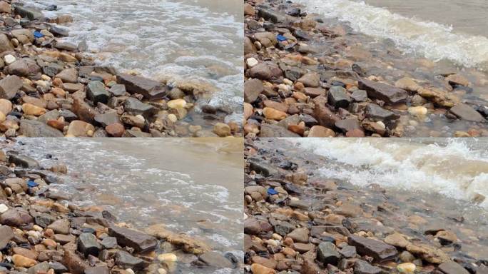 河边鹅卵石江水翻滚拍打浪花河水水位上升