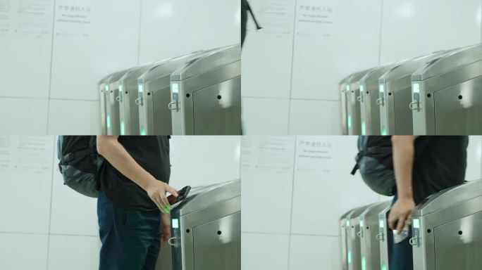 乘客刷手机二维码过地铁站闸机