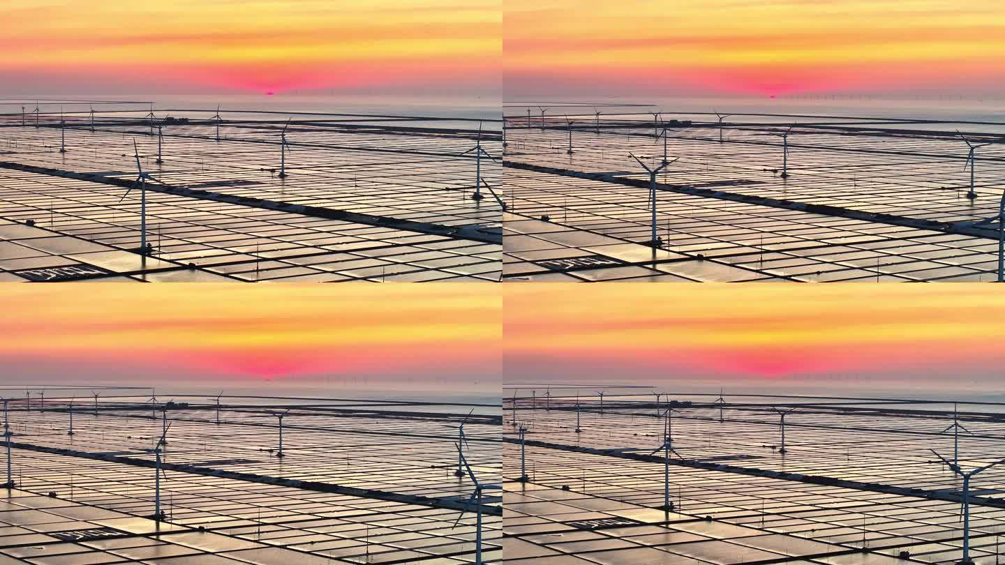 航拍夕阳下的海滩风电场