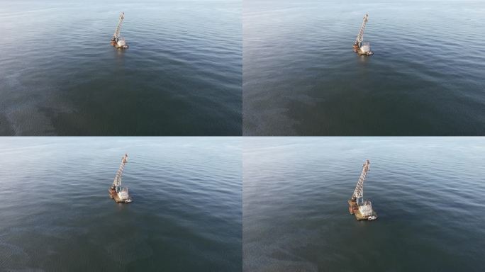 航拍威海西海岸海面上的一条航吊船