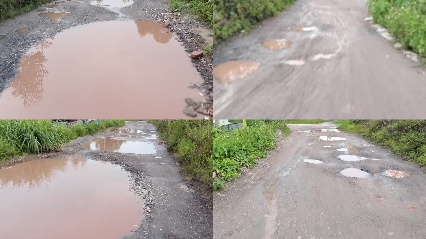 农村泥巴路泥泞路面积水坑坑洼水坑损坏路