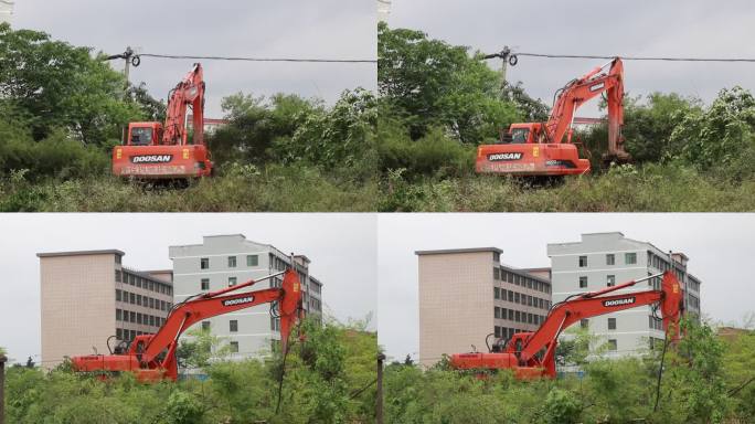 实拍户外厂房前橙色挖机平整土地工作场景