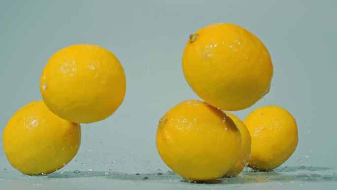 一堆柠檬落下高速特写柠檬黄柠檬