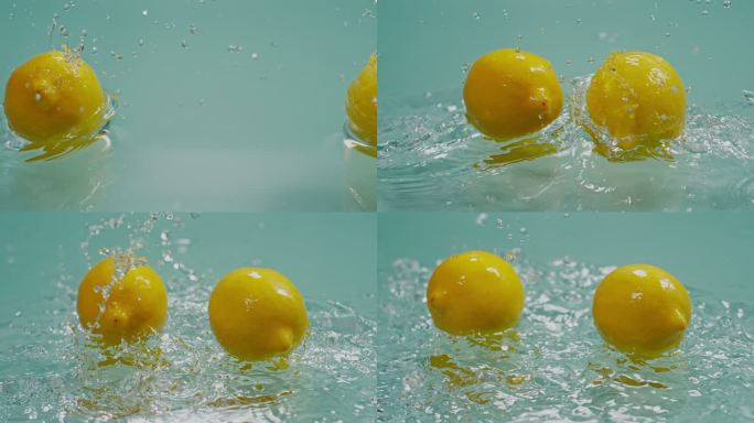 一对柠檬在水面碰撞高速特写柠檬黄柠檬
