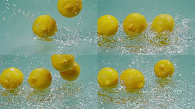 一堆柠檬落在水面水花高速特写柠檬黄柠檬