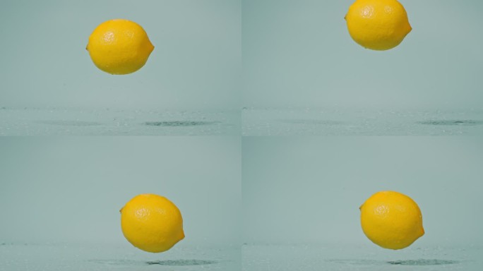 一个柠檬落下高速特写柠檬黄柠檬