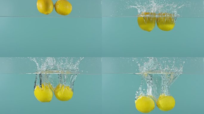 两个柠檬掉入水中特写柠檬黄柠檬