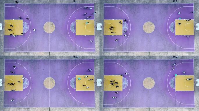 航拍城市校园篮球场上运动的学生
