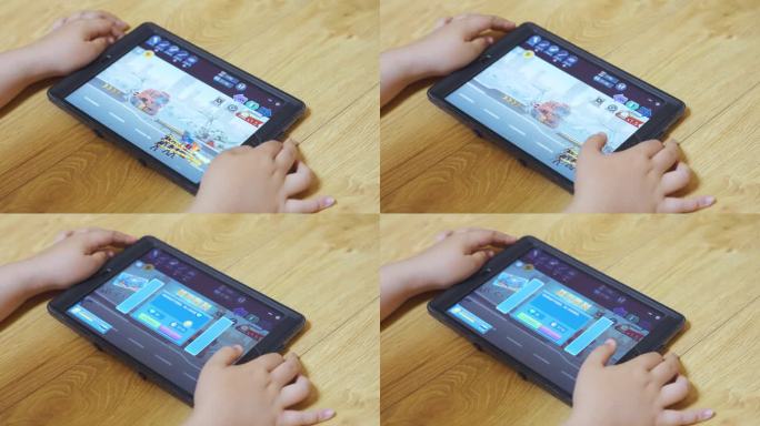 儿童使用平板电脑玩游戏