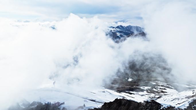 航拍川西雪山云雾缭绕美丽自然风景