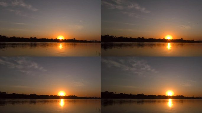 河边日出早晨黎明水天一色水面 朝阳