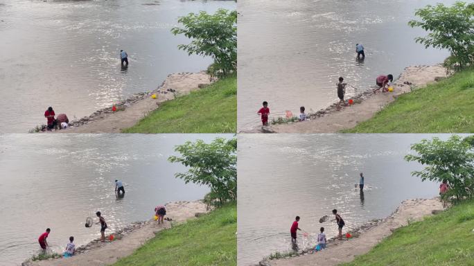 枯水期浅水区河水捞鱼游玩戏水的人