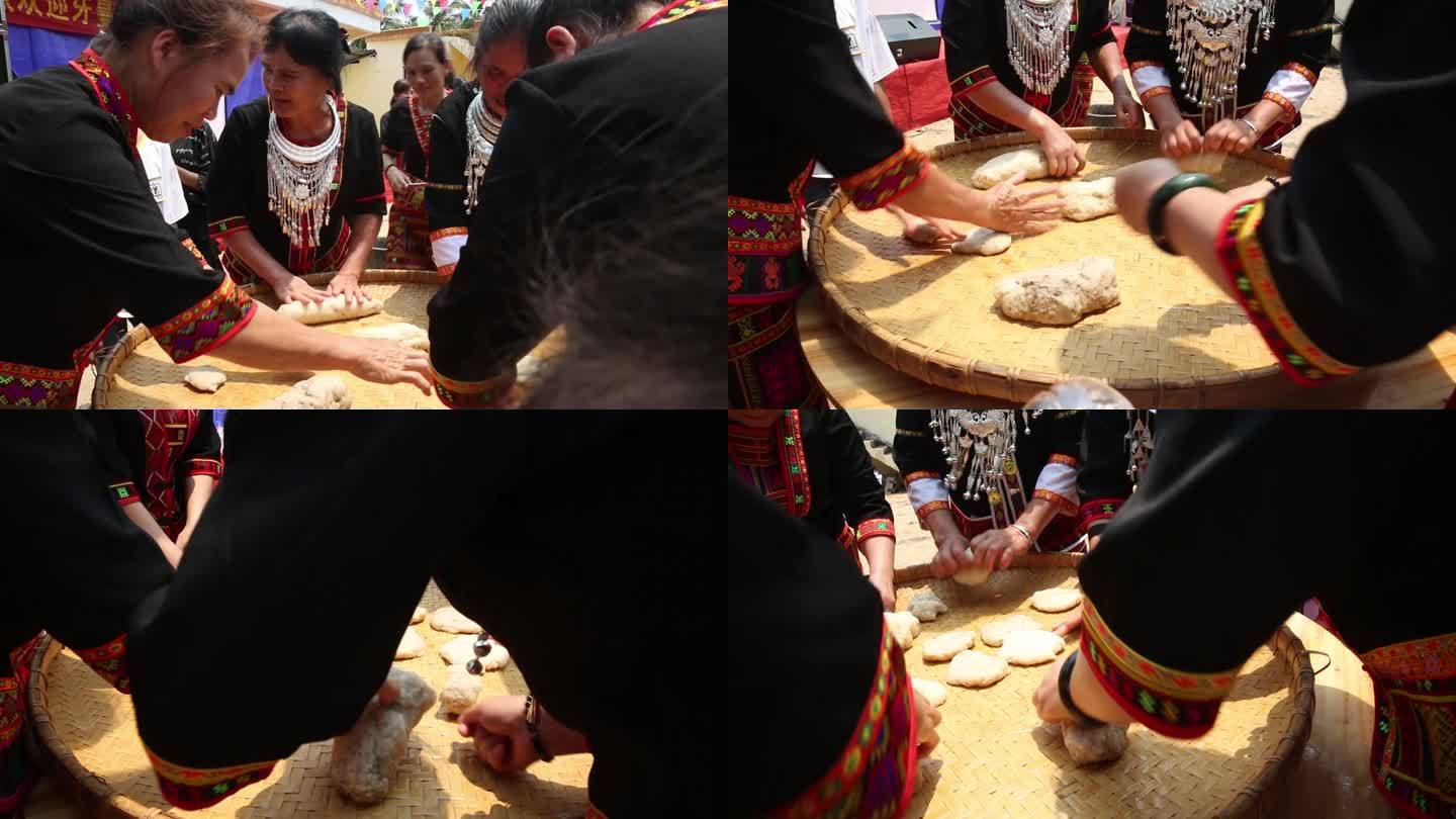 海南黎族妇女身着盛装手工做糯米粑粑