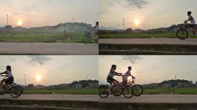 晨曦慢镜头骑自行车剪影乡间小孩骑自行车