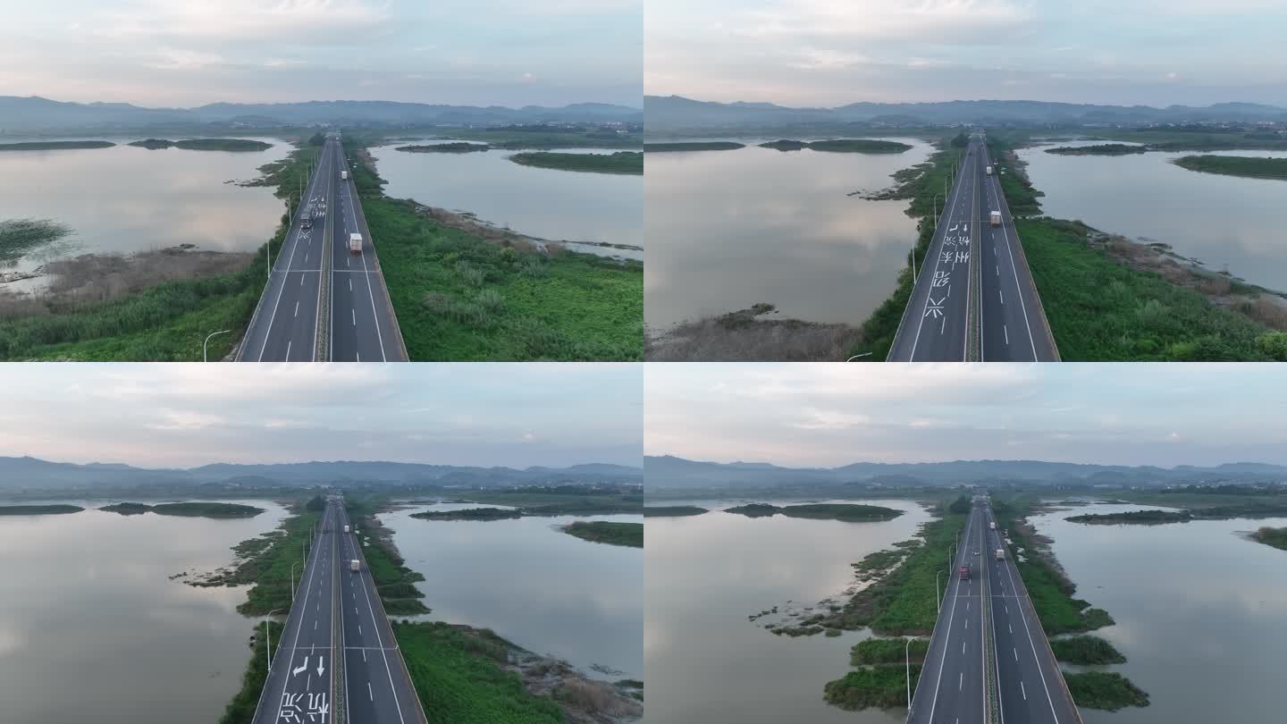 航拍浙江绍兴诸暨高速公路湖面水面货车车流