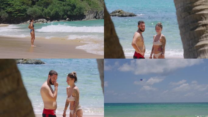 海滩美女情侣降落伞空镜头