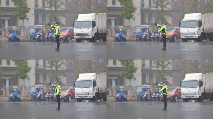 雨天城市道路女交警警察马路中间指挥交通