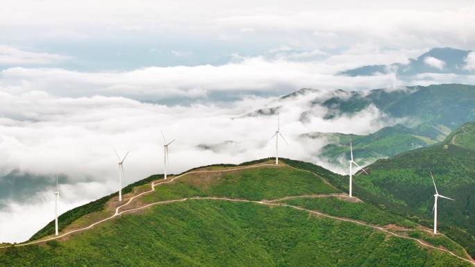 航拍云海中的高山风电场