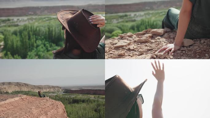 新疆红河谷悬崖边阳光下的女人