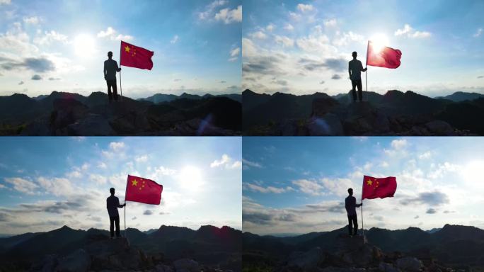 阳光少年拿着红旗站在山顶国旗迎风飘扬爱国