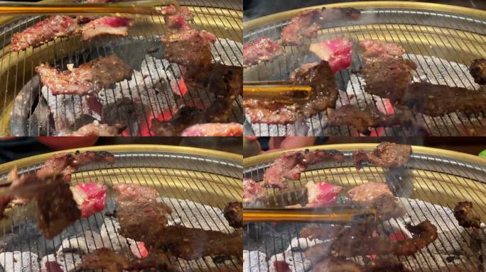 在韩国烤肉店堂食，炭火炉上烤肉