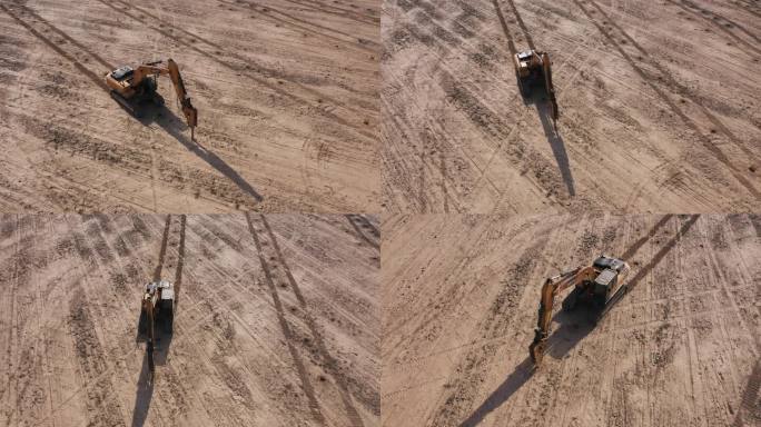 俯拍挖掘钻孔机在沙地打坑作业