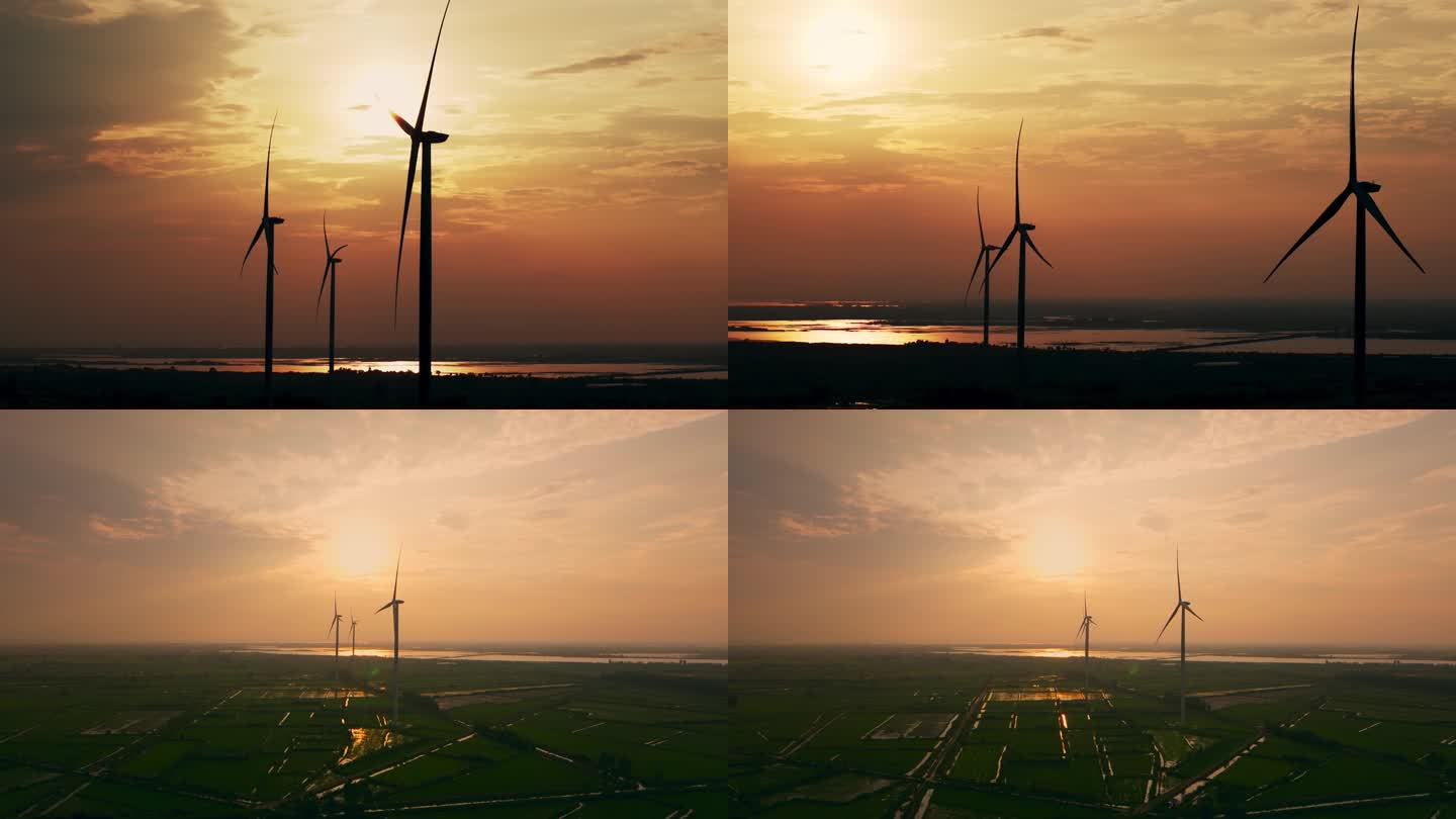 4K夕阳中的风力发电大风车