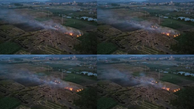 4k视频傍晚农民燃烧田地里的秸秆