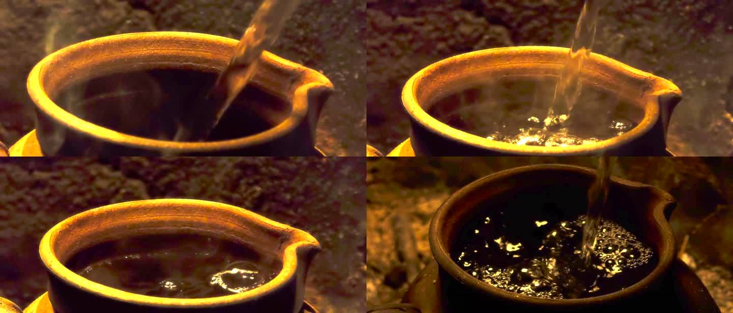 古法传统茶道制茶煮茶 往陶罐茶壶中倒水