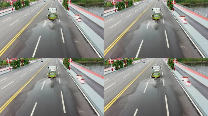 航拍公路上行驶的洒水车