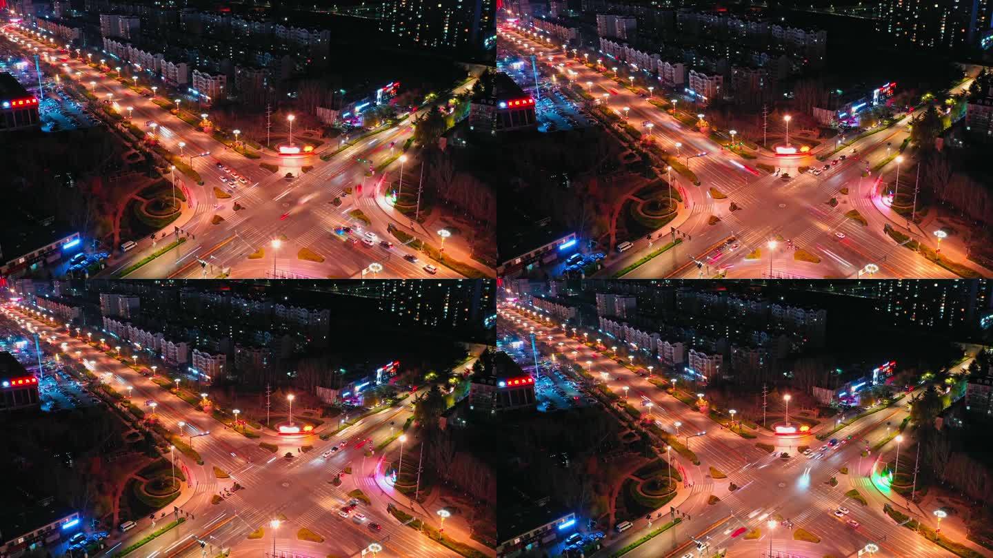 夜晚城市十字路口的车流交通延时航拍视频