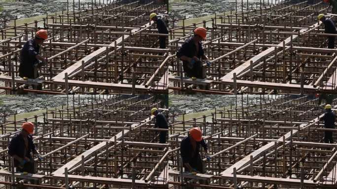 建筑工地施工现场工人安全帽搭模板钢管