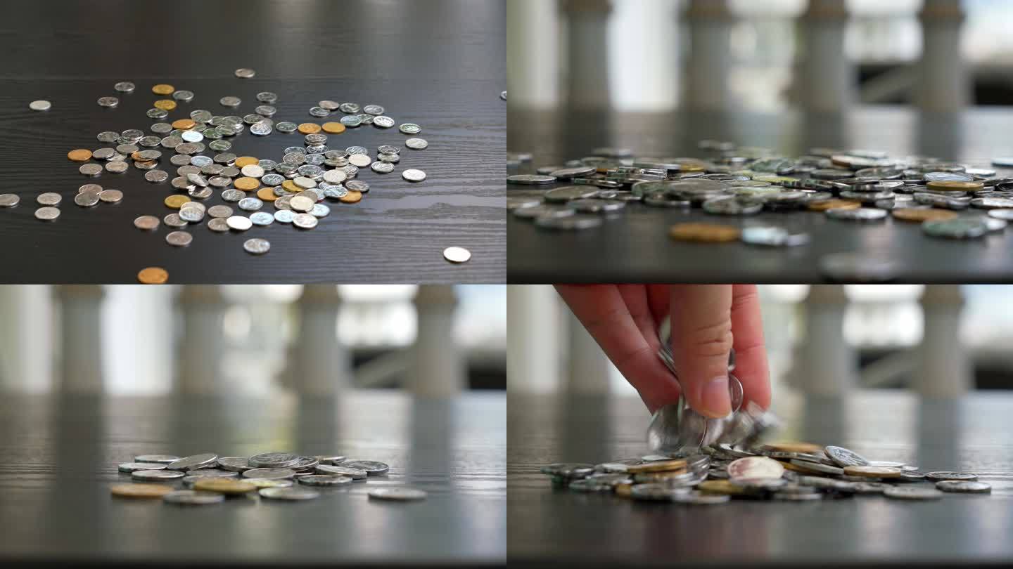 桌面上一堆硬币在下落