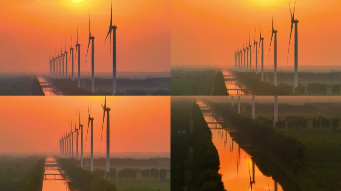 风力发电的夕阳下剪影风车发电新能源