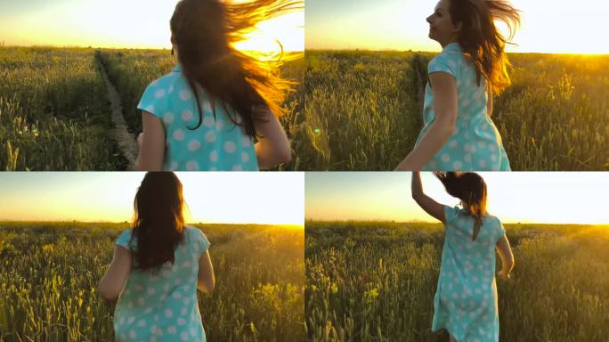 美丽的女孩运行在绿色麦田在日落的天空。自由概念。麦田在日落。慢动作