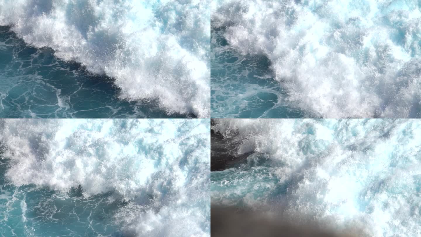 慢动作，关闭: 巨大的湍流泡沫海浪打破。完美的桶波滚动后，岸边和飞溅。大强力膨胀波粉碎岩石礁喷海水滴