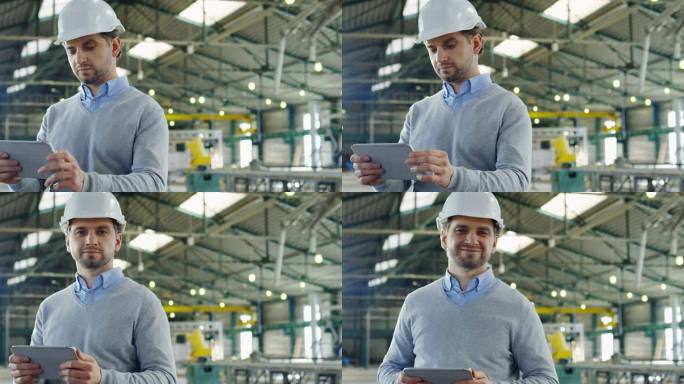 在他的平板电脑上，一个戴着头盔、带着带子和滚动的有吸引力的男性工程师的画像，比在大型工业设施中看着相