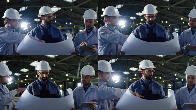 三位戴头盔的工程师用平板电脑和大纸图纸拍摄的肖像照片, 讨论他们的新工作项目。在一个大工厂里.