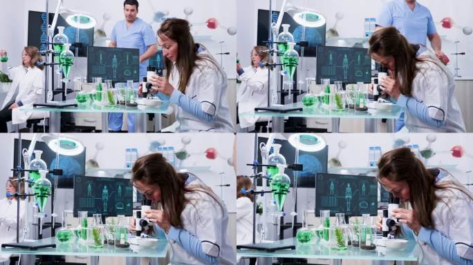 女生物学科学家在显微镜下观察样品