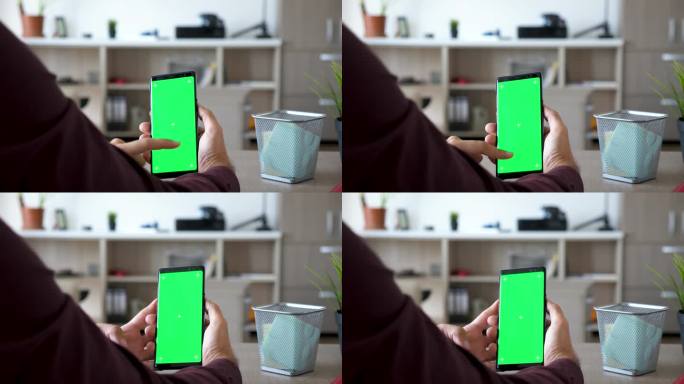 人持有绿色屏幕色度模拟智能手机