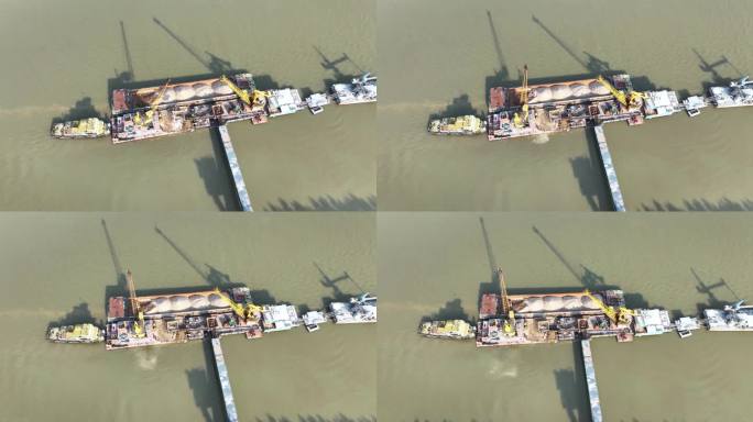航拍长江中升降机开采砂石的轮船
