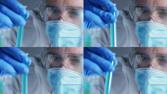 在实验室里、一位科学家带着长笛分析彩色液体、提取试管中的DNA和分子。概念:研究、生物化学、自然、医
