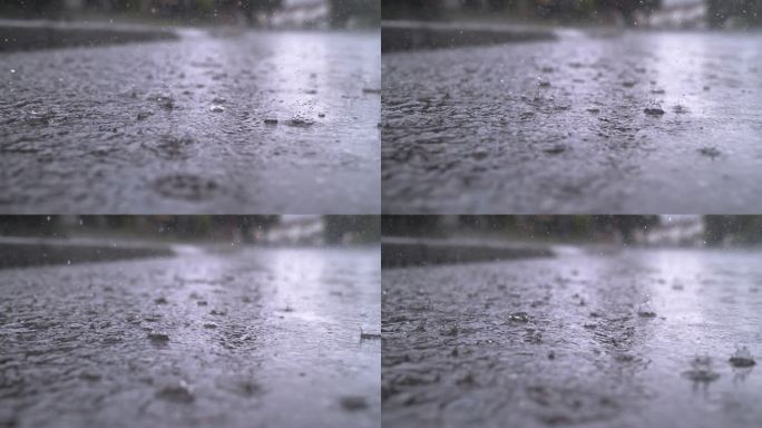 慢动作关闭：秋天的雨滴落在沥青路面上的大水坑里，淹没了街道。雨季下大雨，导致道路被淹。雨滴落在被淹没