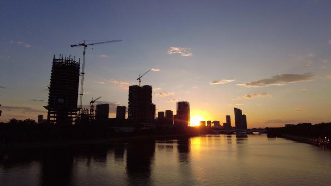 晚霞希望夕阳落日河边新建筑工地城市建设