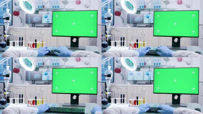 研究员手用绿色屏幕在电脑上打字的视点拍摄