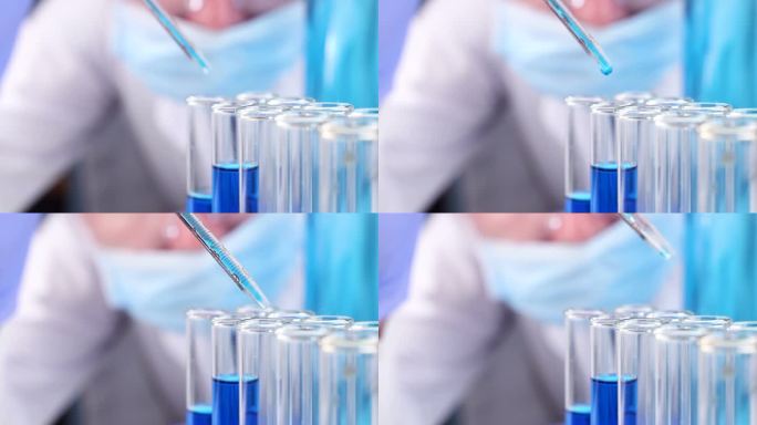 科学家用吸管在实验室滴液体在试管里。特写.