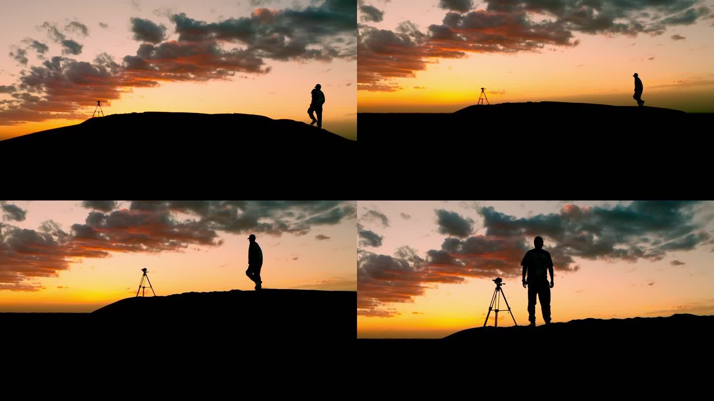 夕阳下爬上山顶的摄影师4k项目